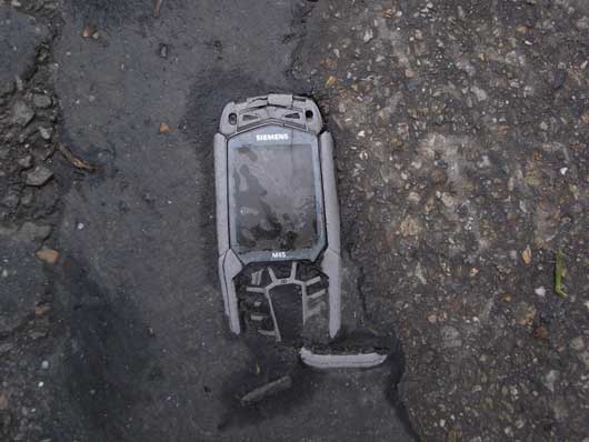 A Mobile Phone Embedded in Asphalt